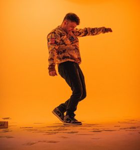 Dampszn on a studio set recording a music video